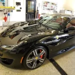 black ferrari in detailing garage